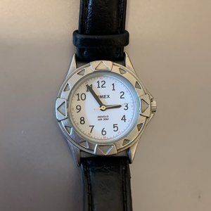 Timex women's wristwatch with silver rim and black leather strap